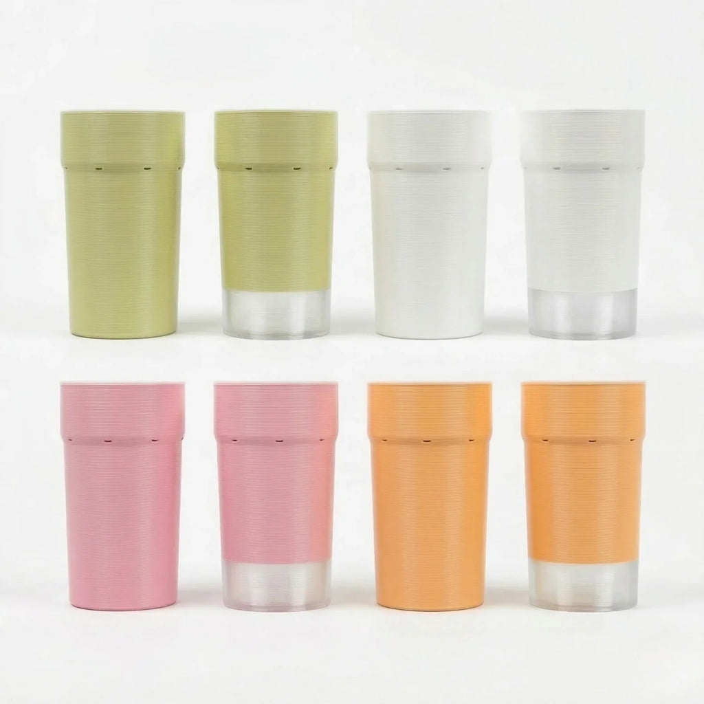 Set of colorful 3D printed self-watering plant pots with clear bases, assorted pastel shades