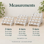 Three white propagation stands compared by size: three tiers measure 20 × 15 × 10 cm, four tiers 20 × 20 × approximately 12.5 cm, and five tiers 20 × 25 × approximately 15 cm. Each horizontal shelf measures 20 × 5 cm.