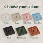 Seven honeycomb drip trays with matching grids displayed against an ivory background. Labelled colours are White, Beige, Baby Pink, Baby Blue, Black, Dark Green and Terracotta.