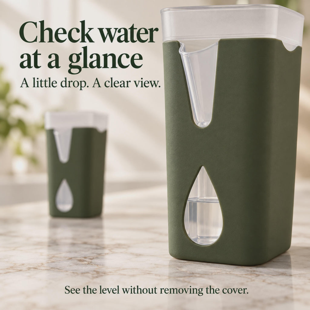 Close-up of a drop-shaped opening revealing the water level inside a clear reservoir.